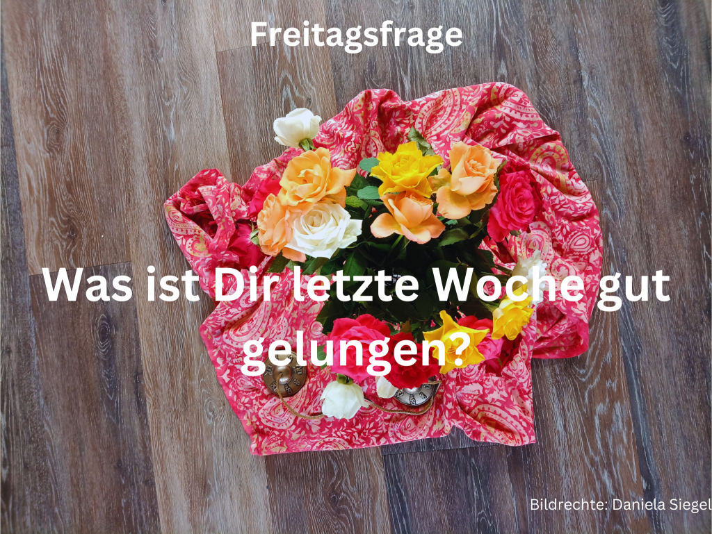 Ein Blumenstrauß von oben fotografiert auf einem bunten Schal